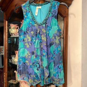 ADIVA ruffled sleeveless top with interesting braided detail on collar.